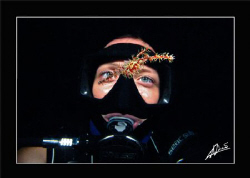 Kaye looking at a ornate ghostpipe fish in Sipadan (Borneo) by Adriano Trapani 